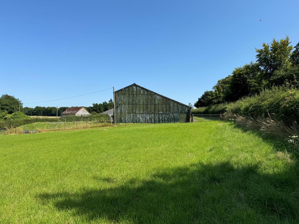 Lot: 75 - FARM BUILDINGS WITH POTENTIAL AND SIX ACRES IN A BEAUTIFUL RURAL SETTING - A Rear on End View of the Buildings